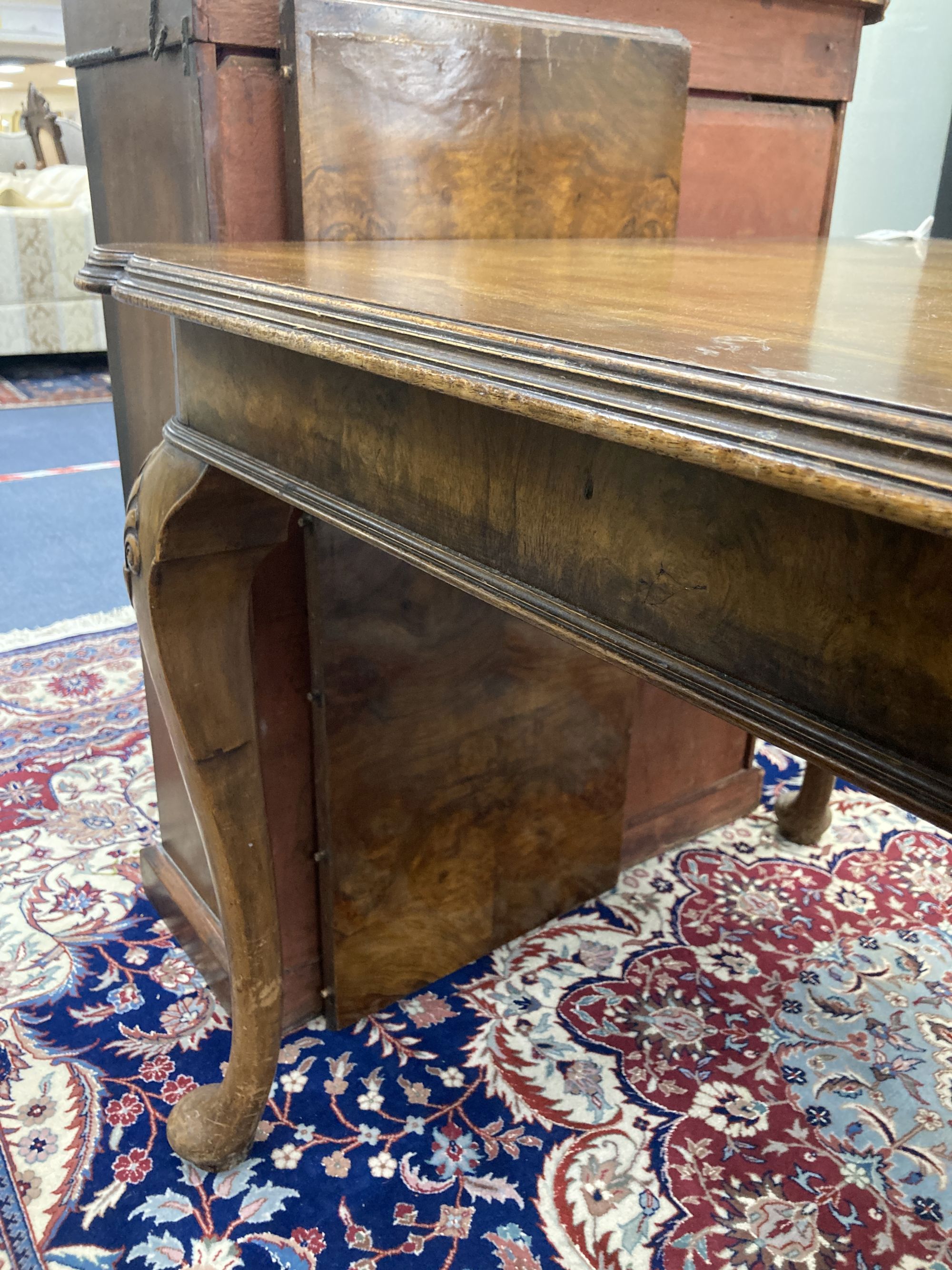 A Queen Anne revival walnut extending dining table, length 182cm extended (one spare leaf), width 90cm, height 74cm